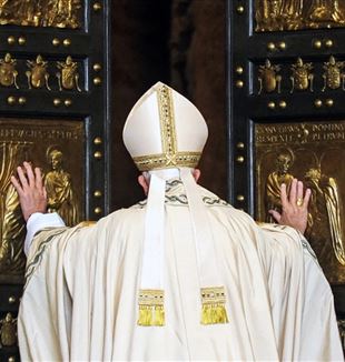 Pope Francis, in 2015, opens the Holy Door of St. Peter's Basilica at the Vatican for the start of the Jubilee of Mercy (© Catholic Press Photo)